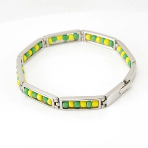 Silver bead bracelet with green and yellow circular beads in a 18K gold frame design