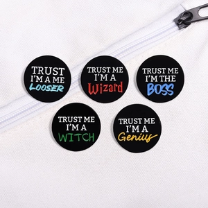 Set of 5 colorful geometric metal pins with creative English quotes on white canvas bag