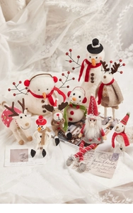 Detailed collection of handmade wool felt Christmas figurines including reindeer and snowmen