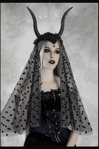 Gothic Halloween headband detail featuring black horns and delicate polka dot mesh veil