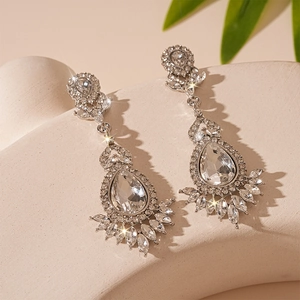 Elegant silver drop earrings featuring sparkling rhinestones in a luxury flower design