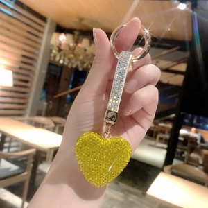 Close-up of a yellow heart rhinestone keychain with a sparkling crystal lanyard