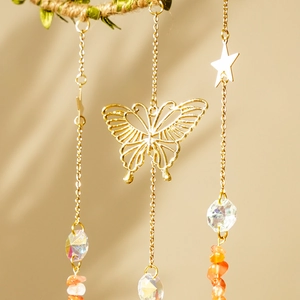 Moon wind chime with natural crystal prisms, golden butterfly, and peach stone beads