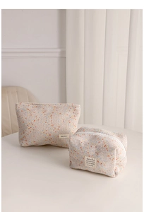 Detail of tweed makeup bags set with rainbow texture and white zipper closure