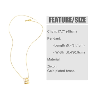 Detailed view of gold plated brass letter E pendant with cubic zirconia and sizing data