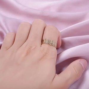18K gold plated 304 stainless steel wavy stacked ring for women shown on model's hand