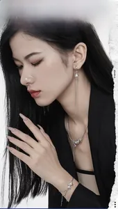 Detail view of a 925 sterling silver jewelry set featuring pearl fringe earrings and necklace