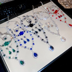 Macro shot of luxury crystal drop necklaces and earrings in multiple vibrant colors