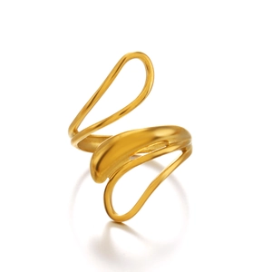 Abstract wavy gold stainless steel ring with minimalist flowing lines on white background