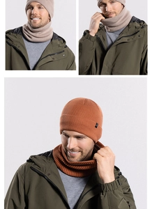 Detailed knit texture of winter beanie and neck warmer set in beige and caramel