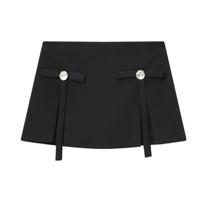 Elegant black A-line mini skirt with rhinestone bow details in a flat lay view