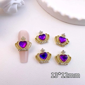 Detail of 13x12mm golden crown nail charms with purple heart stone and tiny rhinestones