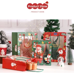 Close-up of festive Christmas gift bags with window design and gingerbread man metal tins