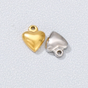 Polished heart-shaped stainless steel pendants in gold and silver finishes for jewelry