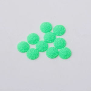 Detail of 12mm green resin cabochons with sparkling druzy texture for DIY jewelry making
