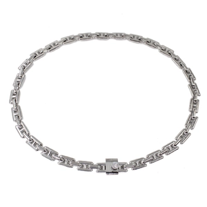 Detail view of silver H-link chain necklace with crystal-encrusted square clasp