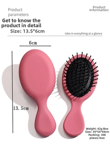 Detailed view showing the compact 13.5x6cm pink massage hairbrush with soft air cushion