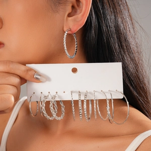 Set of 12 minimalist silver hoop earrings featuring geometric rhinestones and textured designs