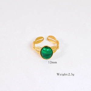 Detail of 14k gold plated ring with a 12mm green malachite stone and leaf textures