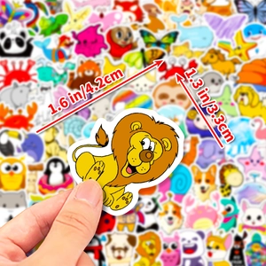 Close-up of a cute 4cm yellow lion sticker with dimensions showing scale and detail