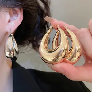 Minimalist chunky U-shaped hoop earrings in gold and silver finish for women