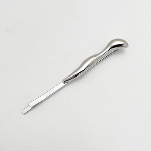 Detail of silver drop-shaped alloy hair clip showing metallic luster on white background