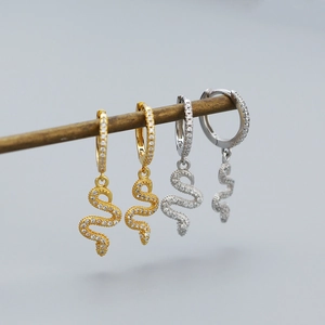 Detail of snake drop earrings with micro-pave zircons in gold and silver finish