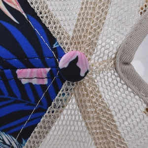 Detail of floral print fabric and breathable mesh crown on the ponytail baseball cap