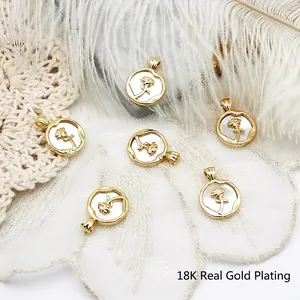 6-piece set of 18K gold-plated round rose pendants displayed with white feathers