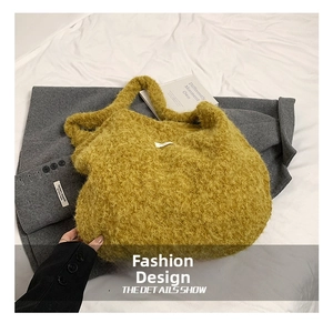 Close-up of mustard yellow plush knit shoulder bag showing soft texture and large capacity