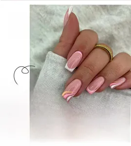 Close-up of pink and white French press-on nails with wave pattern design