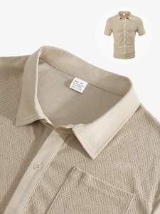 Close-up of beige honeycomb textured fabric on a short sleeve shirt showing detailed material