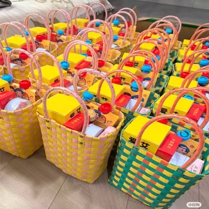 Detailed top view of handmade woven gift baskets with cotton towels and yellow boxes