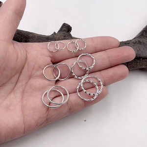 Set of s999 sterling silver hoop earrings with smooth and twisted textures in various sizes