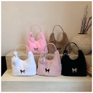 Detailed plush hobo bags in five colors with silver butterfly clips and fluffy pom-poms