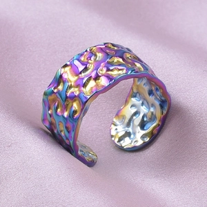 Macro shot of 304 stainless steel adjustable ring with iridescent hammered texture detail