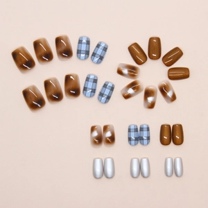 Detailed set of brown tortoise shell and blue plaid cat-eye press-on nails with silver accents