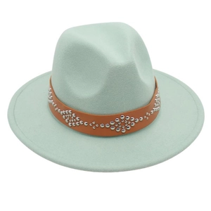 Detail of mint green wool felt jazz hat with brown studded leather band decoration
