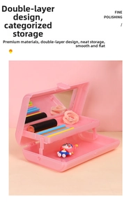 Macro view of a pink folding double-layer plastic makeup box with built-in mirror inside