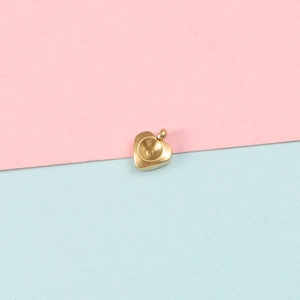 Detailed view of heart-shaped gold stainless steel pendant tray with circular recess
