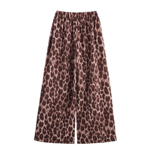 Detail view of leopard print wide-leg trousers with elastic waistband for women