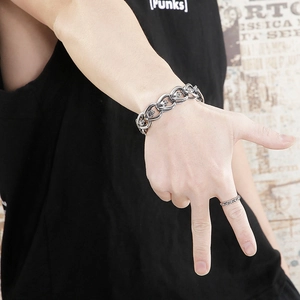 Close-up of vintage punk style heavy link bracelet with skull details on wrist