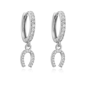 Detail shot of silver horseshoe earrings with cubic zirconia stones on white background