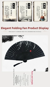 Detail of black silk folding fan featuring willow patterns and an elegant silk tassel