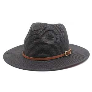 Close-up of black straw fedora hat with brown leather band and gold metal buckle detail