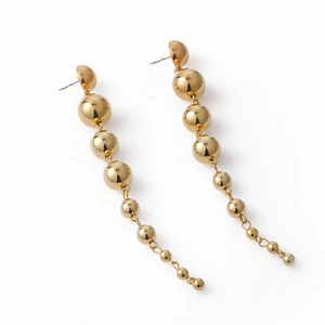 Punk style long drop earrings with metallic gold beads in a minimalist geometric design