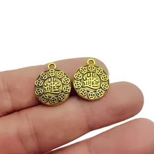 Detail shot of antique gold peanut charm with lucky coins and size 15mm by 18mm