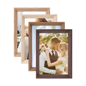 Detail of solid wood photo frames showing natural grain textures in four various wood colors