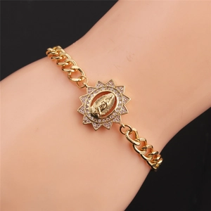 Detail of gold-plated bracelet with Virgin Mary octagonal charm and pink zircon stones