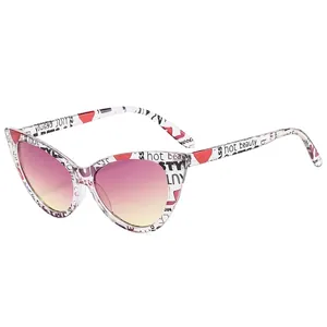 Cat eye sunglasses featuring transparent frames with red hearts and gradient lenses